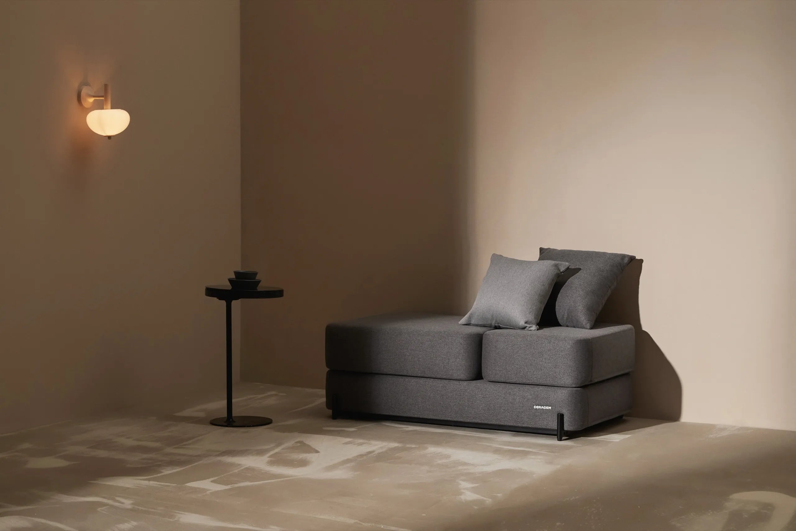 The Master S4 in a dark-toned modern space with gray upholstery